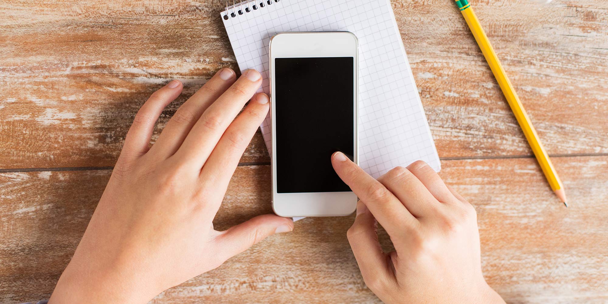 Wipe the handset surface with a dampened microfiber cloth to eliminate fingerprints and dust. But if it’s still sticky, mix one cup of water with one drop of mild detergent to wipe off and then rinse area (not the screen) with a clean dampened cloth. Don’t spray anything into the handset or keys.